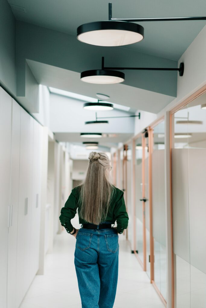 Woman walking in a hallway