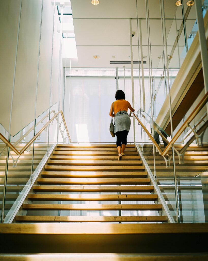 Woman taking the stairs to work